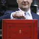 Image for article titled Here’s why Brits brandish that weird little red suitcase on budget day